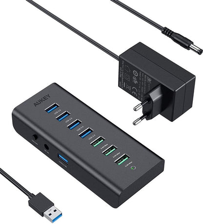 AUKEY USB Hub Powered Charging CB-H19, 7 Port USB 3.0 Hub with 3 Charging Ports, 4 USB 3.0 Data Ports, 12 V/3 A Power Adapter, Power Switch for Laptop, PC, Mac, Hard Drive Hard Drive (black)